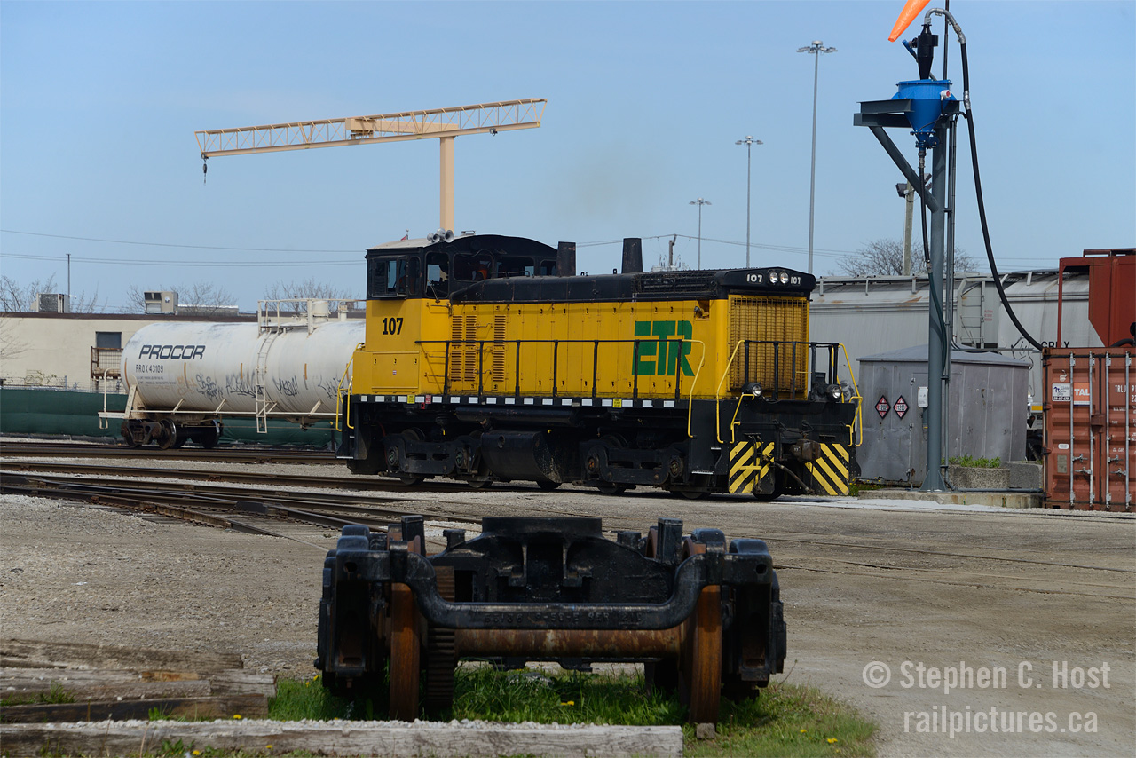ETL 107, a former EMD Demonstrator SW1500 has just exited the Essex Terminal Railway's engine shop and will head out to start switching customers on a late April afternoon. Jacob and I took the day off to finally get to Windsor and get this operation off my list (having only been in January 2006 I always wanted to go back) and with the 2 Heritage units out and about the goal was to get one of them: we got none. Little did I know that there were plans to repaint every locomotive out of the late 20'th century yellow scheme and that these photos would age very quickly as now, there isn't a yellow locomotive on the property. Note the spur and set of trucks - that is the former ETR Belt line that ran toward Downtown to serve a few industries, the lands of this former line were sold to local developers in 1998. For anyone interested, an article on the ETR will be going to Railfan and Railroad's March edition, which you can find at newsstands (Indigo/Chapters stocks it nationwide in Canada)