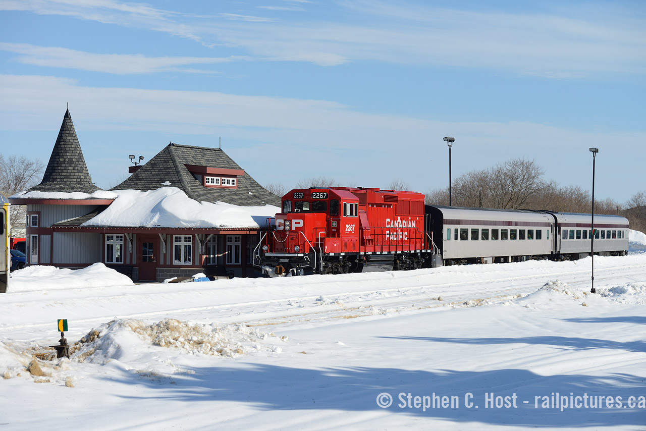 After a fire destroyed the Orangeville Bunkhouse according to those in the know (Mr. Bradley et al) insurance settlement allowed the town to re-build a new structure in Orangeville. So they built a sorta replica of the Orangeville Station on the station site, complete with a witch hat. The actual CPR station still survives and was moved off property to become a restaurant, but for about a decade this replica building was alive with rail service - complete with a waiting room and washrooms for Credit Valley Explorer patrons. What a great station and a shame the town decided enough with railways. Alas, it is still a nice looking station just no rails at present time, and now used as  a GO bus station. Pictured 12 years ago is the "Snow Train" with a briefly loaned brand new Eco on the point pulling into the station after completing the last run of the weekend. This would be last passenger train until that spring.