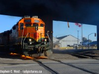 When these things were patched a year ago, Jacob and I decided to head to Hamilton to see if it was out and about - sure enough, it was, and after following them for a little bit we realized they'd run-around and shove into Railcare with this thing leading in nice light. <a href=https://railpictures.ca/author/ettorrematthew target=_blank>Matthew Ettorre</a> was also out and had the same idea, so the three of us watched them shove into the railcare yard with a cut of cars, only to slow to a crawl, and notch up into 8 under the bridge - with a sound and smoke show to match multiplied by the bridge blasting it all right back down at us - naturally we're smiling at the smells and sounds before us. I didn't think sound and smoke would get any better, then the sparks began to fly. The crew didn't take long to realize what happened and were able to recover and shove into the yard without much issue. I know the Hamilton crews watch this site - I hope they see this :) <br><br>A footnote is I'm told this unit was painted recently - why is CN in such a hurry to paint the BNSF four axle locomotives they purchased but seemingly nothing else in the series? Any ideas? Seems strange.. if you know of any other repaints or have any other ideas please comment below. 
