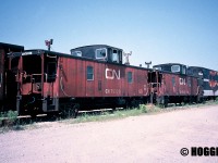Retired CN Hawker Siddeley cabooses 79728, 79328 and 79212 are shown awaiting their fates at the S Yard at CN’s MacMillan Yard in Vaughan, Ontario. Also seen behind the vans were two retired Car-Go-Rail cars that were used in Super Continental passenger service. 