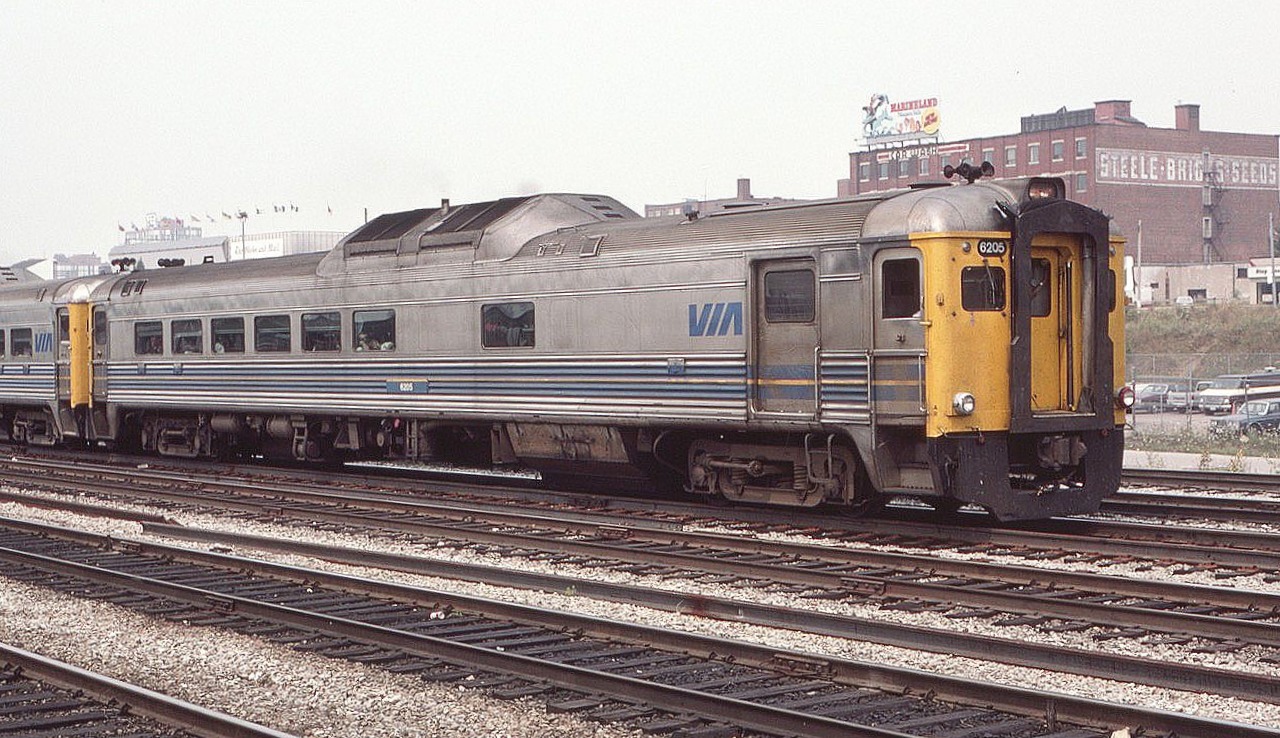 Never a big fan of RDC's but staying with the motto, "If it's there shoot it," here is a view of Via RDC 6205 near Toronto Union Station in August of 1985. 40 plus years later, that's a long time ago folks. The Globe and Mail building, resplendent with various flags on top, is seen above the rear of the RDC. What's more outdated, RDC's or newspapers??