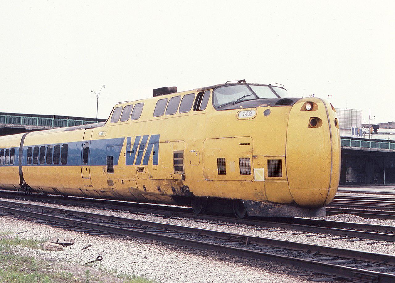 Brightly colored Via Turbo train, led by unit 149, is inbound to Toronto Union Station in July of 1982. This kid from south of the border in NY state was not sure what exactly he was looking at but took a photo anyway. The Canadian flag on the Globe and Mail building is seen just above the nose of the unit. I see that this was slide number 39 on a 36 shot roll of film, so I got the best of Kodak on that day all those years ago.