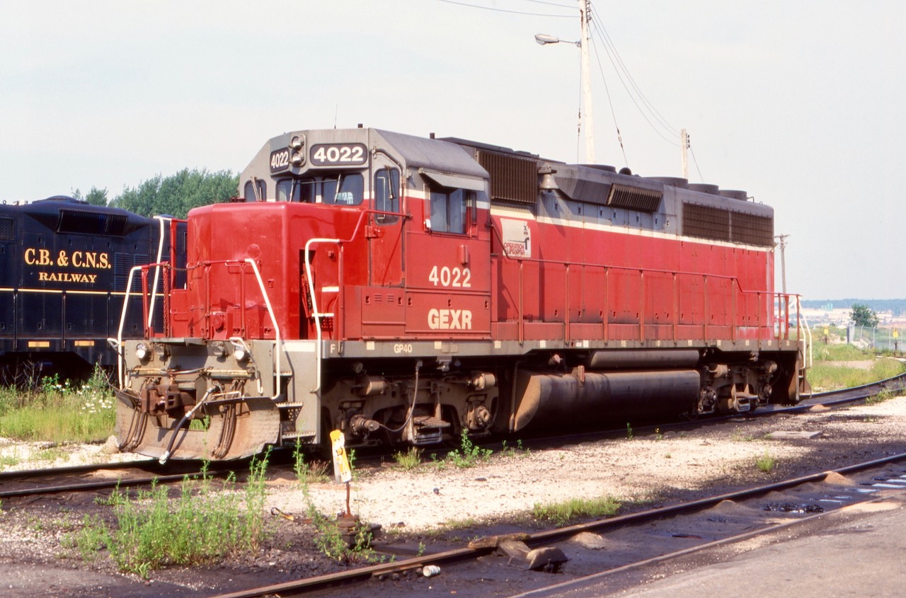 This was a bit of a depressing trip, but one I was determined to make. If I was only able to make it a few years earlier I would have been able to catch active six axle Alco’s. Unfortunately Sydney’s era of being an industrial strong hold was over. The railroad here was barely hanging on to life as well. Today the rails are long out of service with no remaining motive power on this end of the CBNS. While nothing was moving this day we were rewarded with a large variety of motive power to photograph. The big and small Alco’s were still on the property but out of service and in poor picked over shape, most would be gone in the next couple of years. A variety of EMD’s were here as well, from GP7’s and GP9’s to a very familiar GP40 far from home. GEXR 4022 originally started life on the N&W roster. During its GEXR years it passed my view finder many times, but this would be our final encounter. It would survive on the CBNS for a few more years before finally leaving and from the reports I got it eventually was rebuilt into a Genset.  Of note this day GEXR GP7 700 was also here  in the yard. I don’t believe it survived very long here.