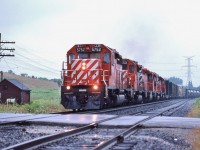<br>
<br>
Quintette of GMD's
<br>
<br>
All SD40 / SD40-2
<br>
<br>
CP Rail 5752 – 5531 – 5xx8 – 5xxx – and the original #5500 trailing.
<br>
<br>
Rare on the Belleville, without a couple MLW's mixed in.
<br>
<br>
CP Rail 905
<br>
<br>
at Cherrywood, August 2, 1987 Kodachrome by S.Danko
<br>
<br>