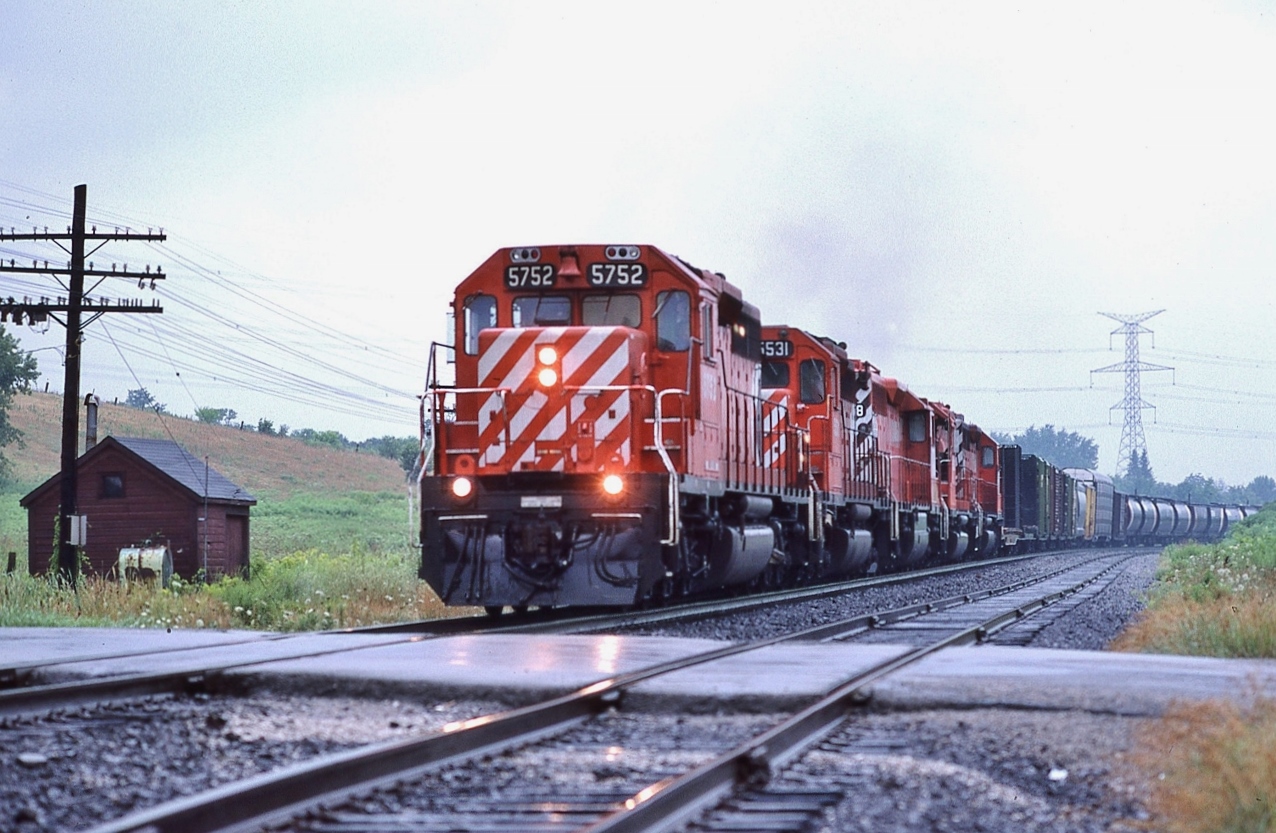 Quintette of GMD's


All SD40 / SD40-2


CP Rail 5752 – 5531 – 5xx8 – 5xxx – and the original #5500 trailing.


Rare on the Belleville, without a couple MLW's mixed in.


CP Rail 905


at Cherrywood, August 2, 1987 Kodachrome by S.Danko