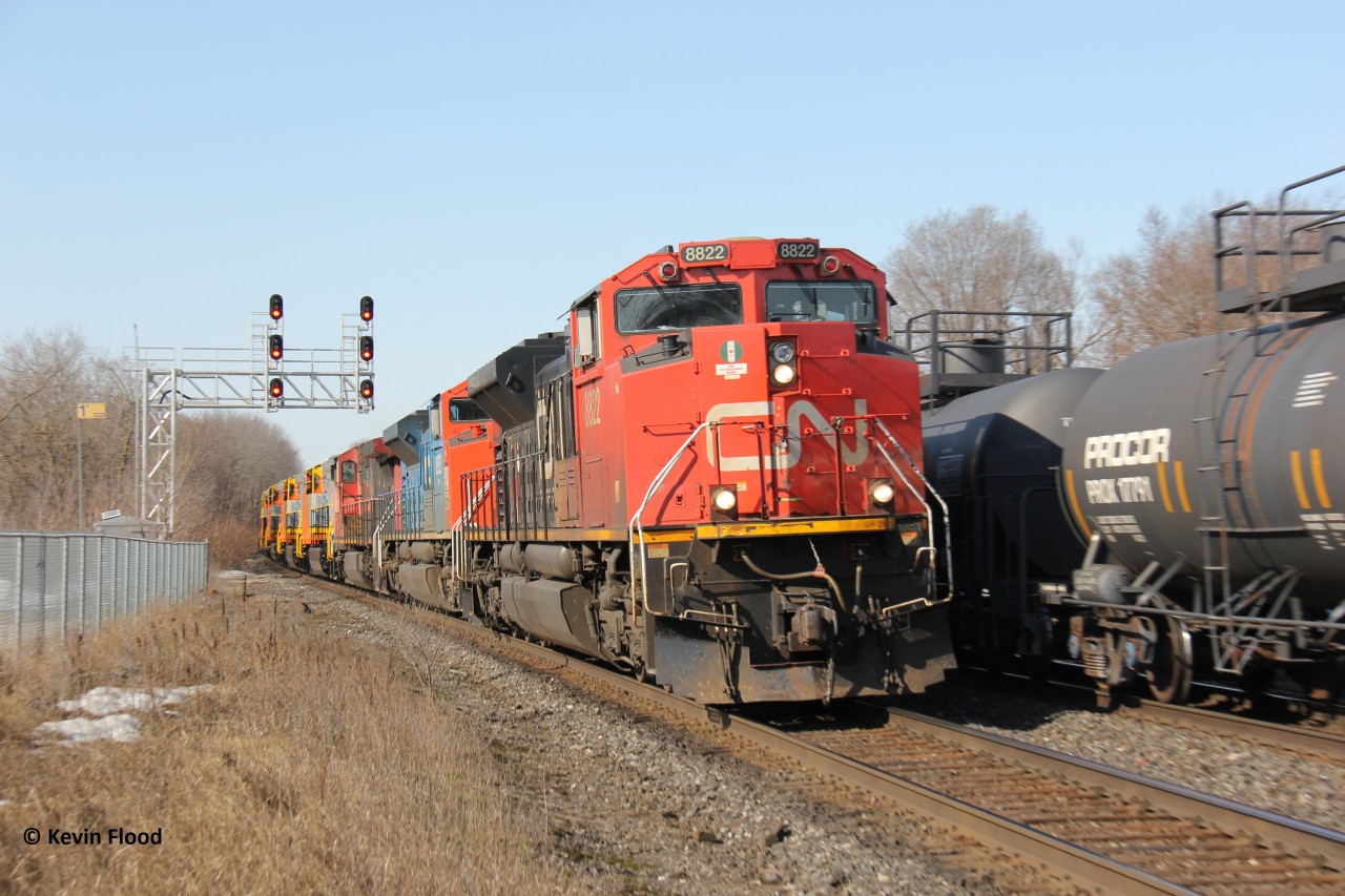 It was a nice sunny day during March Break and it was one of those days where a few good trains were running, including a CP CWR train with a fresh pair of SD40-2s. This train was also around and got me out earlier. Trailing the lead units were some ex-QNS&L and ex-KCS units (70MACs, not pictured) destined for ONR (well at least the ex-KCS ones) (if I recall correctly). Almost perfect here if the CN 8952 led. My daughter joined me since she was off of school.