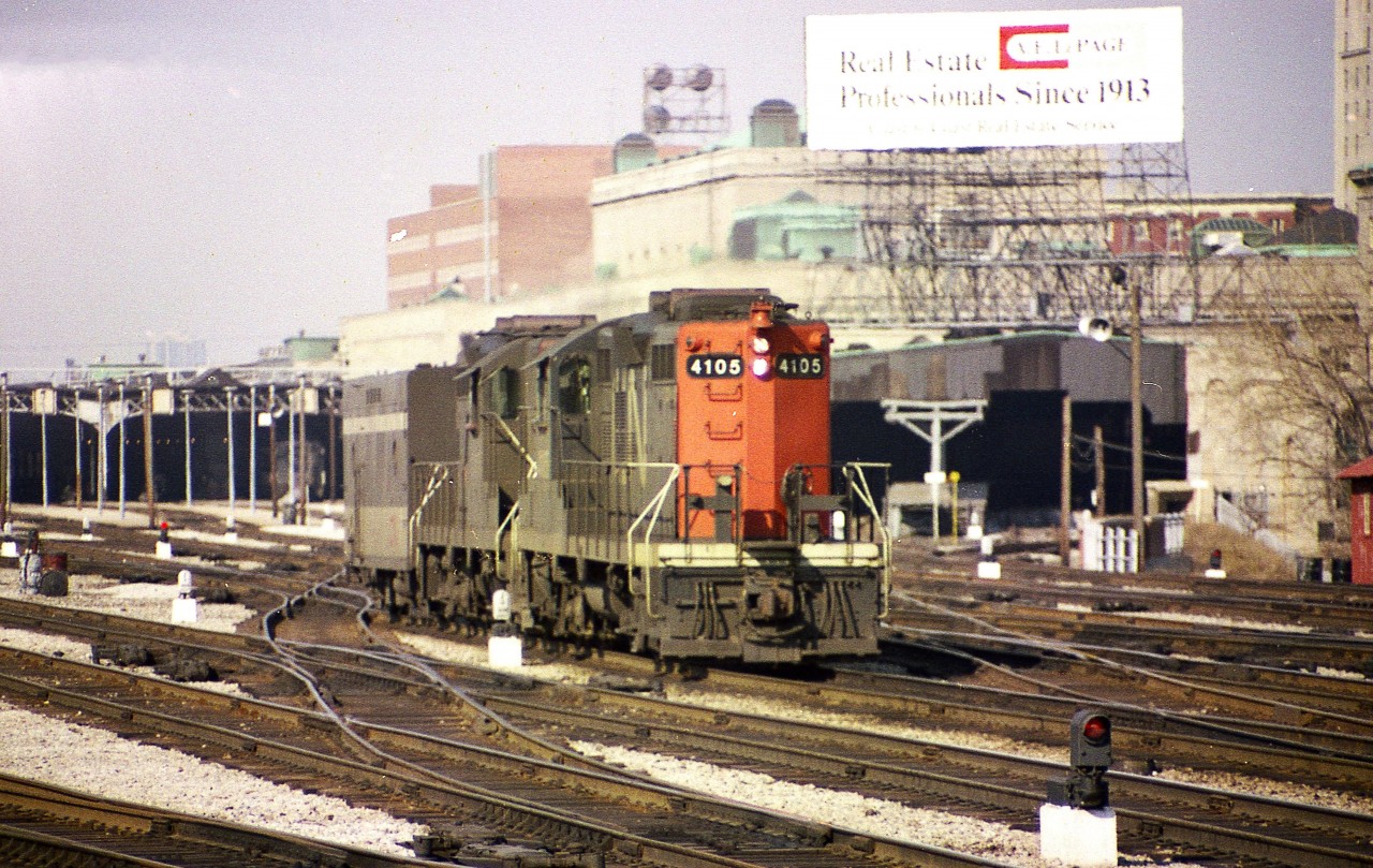 Just east of Union Station; CN 4105, 4102 and a steam jenny will soon be making up a passenger train in order to run eastward.
I'm disappointed I took that access point to the tracks for granted back then. Or maybe it was just that I did not get caught. :o)