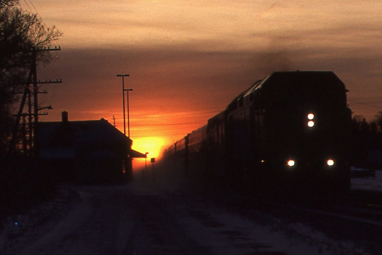 After a day of hunting snowplows near Stratford, a quick stop was made in Ingersoll probably for a coffee and a bite to eat before heading back towards the GTA. A stop by the station found the sun setting directly in line with the Dundas Sub and the headlight of VIA No 78 rapidly approaching. I'm guessing the exposure on this Kodachrome 64 slide was a fluke. Sometimes you take the shot and score.