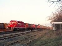 For a few days back in the spring of 1995, CP trains thru Niagara were detoured over the CN Grimsby sub while some maintenance work was being done at Hamilton's Hunter St tunnel.
As with most CP trains over the normal route I would see in Niagara Falls, they ran late in the day. It was to my advantage here in this image across from where the old Merritton station used to stand, as the late day sunlight gave the head end power a pleasant glow.
Seen here on CP's #521 are: CP 5652, 1803, 4250, HLCX 521 and CP 1815, an interesting mixture of locomotives.