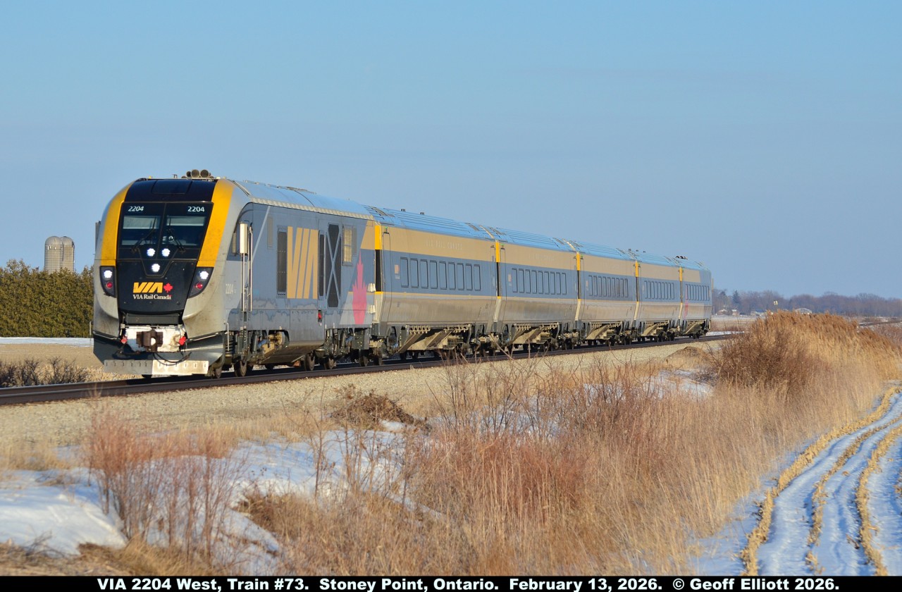 VIA Train #73 can be seen accelerating out of the siding in Stoney Point, Ontario after having met CN train #438 just a few minutes ago.  Train #73 is running a little over an hour late at this time and the meet in Stoney Point just added a few minutes to the trip for everyone on board.