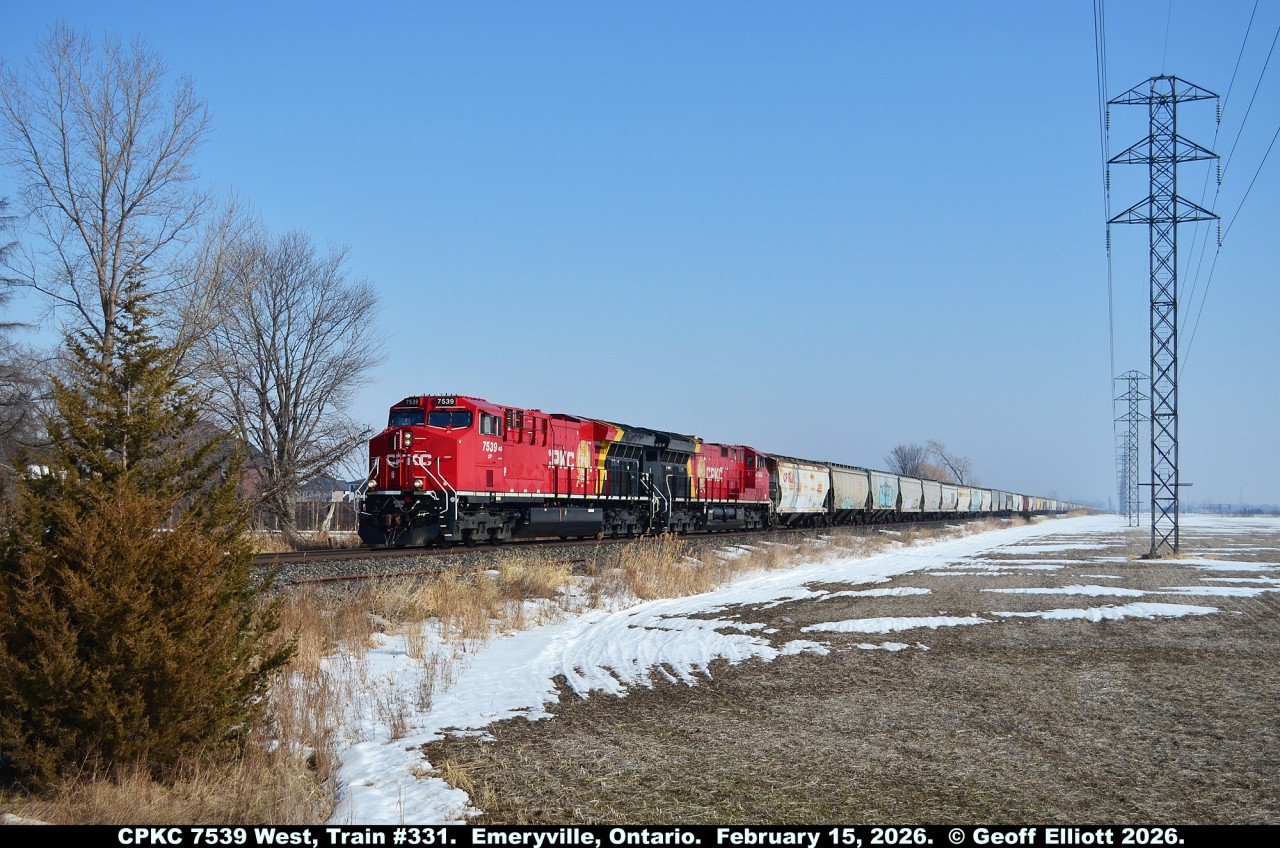 With a heads up from Brady Butler when train #331 passed Tilbury, I was able to get out to get a decent shot of train #331, with a pair of fresh CPKC GE's, as it approaches Renault Line in Emeryville, Ontario on February 15, 2026.  #331 was a solid train of about 200 empty grain hoppers headed back to Western Canada via Chicago for re-loading.