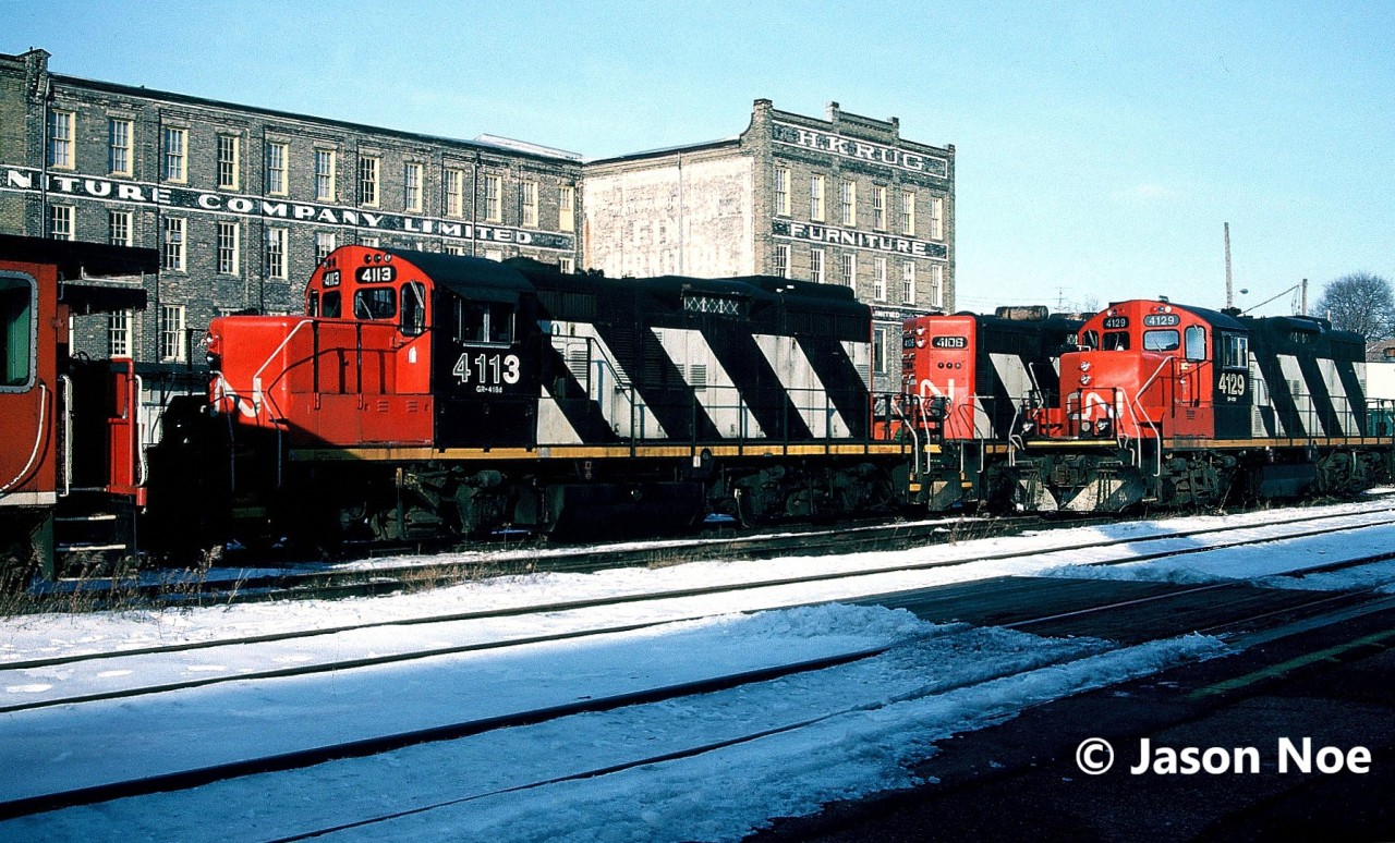 During a Sunday afternoon, CN GP9RM’s 4129 and 4113 with 4106 await their next week’s assignments at Kitchener, Ontario.