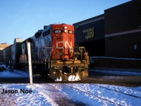 By the beginning of 1996, both CN and CP had completed the deliveries of their latest motive power. CN’s order of SD70I’s (5600-5625) and CP’s order of AC4400CW’s (9500-9582) had assisted both railways with easing some of their previous motive power constraints. While summer prior, CP had officially retired their last big MLW’s, they still had an active roster of RS18u’s and C-424’s operating in Ontario and Quebec. As well, despite the addition of the 83 new AC4400CW’s, the railway continued to lease hundreds of units through various companies, mainly Helm Leasing. CN continued to roster a small number of operating M-636’s, plus had their HR-616’s, M-420(W)’s and HR-412(W)’s working mainly in Ontario to eastern Canada. However, the company’s next big order was due to start arriving that summer, in the form of 105 new SD75I’s from GMDD in London, starting at CN 5626. Additionally, the start of the Canadian shortline takeover of CN and CP’s unwanted secondary lines and branchlines was still over a year away. Although, many had already fallen or were in the process of being abandoned. Two local examples were the CP Owen Subdivision from Orangeville to Owen Sound and the CN Newton Subdivision from Stratford to Palmerston, as well as the remainder of the CN Owen Sound Subdivision to Harriston.
<br>
Here, the Goderich-Exeter Railway (GEXR) takeover of the CN Guelph Subdivision was just under two years away as CN GP9RM 4101 leads one boxcar through downtown Waterloo on the Waterloo Spur. The 15:30 Kitchener Job was taking the car to Commonwealth Plywood in north Waterloo and would then return light power back to the Kitchener Yard. 
