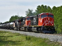 On another beautifully sunny day in June brings a brand new CN SD75IACC leading an LPG train. CN is rebuilding these locomotive from their older SD75I/SD70Is. 