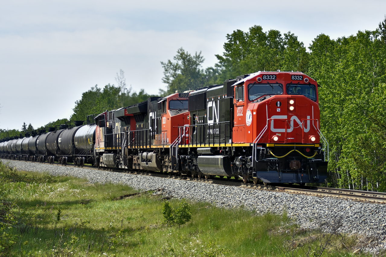 On another beautifully sunny day in June brings a brand new CN SD75IACC leading an LPG train. CN is rebuilding these locomotive from their older SD75I/SD70Is.