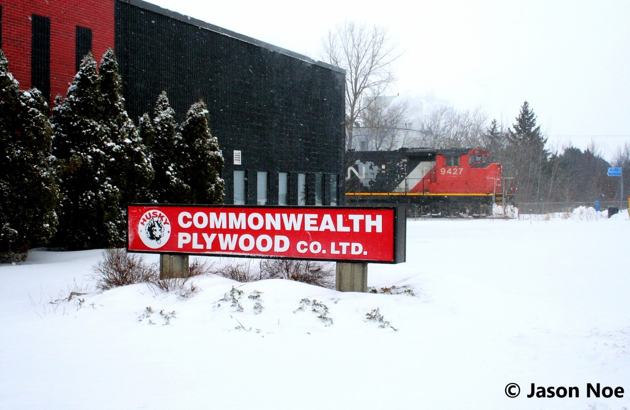 During afternoon snow squalls, the previous night’s CN L566 is viewed timed-out at Randall Drive in north Waterloo, Ontario on the Waterloo Spur. Powering the job were GP40-2L(W) 9427 and GP38-2 4725. A year later, CN made the job “as required” however they still usually operate three times per week to Elmira, based on observations.