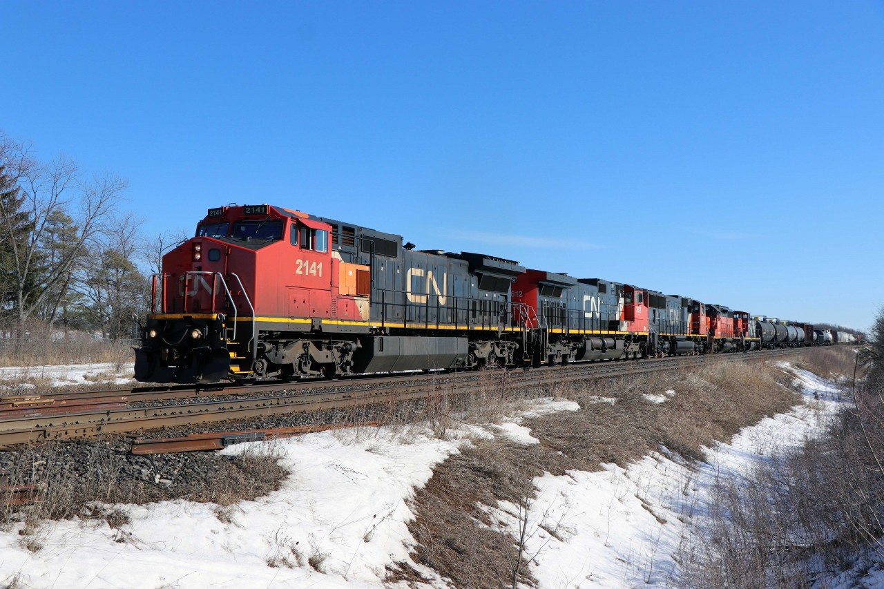 As this shot is posted, has it been five years already? Here we have Port Robinson-MacMillan Yard train 422 approaching Lower Baseline Road behind C40-8W 2141, C44-9W 2612, SD75I 5648, BLE SD38 768, and GMD1u 1438. Today, there is a grade separation at this location and the intermodal terminal is nearing completion nearby; most of CN's C40s have been retired (a few are in storage); many of CN's C44-9Ws and SD75s have been rebuilt to AC traction; and some of the SD38s--as well as all of the GMD1s--have been retired. At least the Halton sub is still a key part of CN's network.