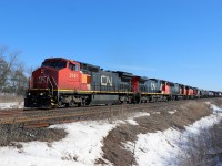 As this shot is posted, has it been five years already? Here we have Port Robinson-MacMillan Yard train 422 approaching Lower Baseline Road behind C40-8W 2141, C44-9W 2612, SD75I 5648, BLE SD38 768, and GMD1u 1438. Today, there is a grade separation at this location and the intermodal terminal is nearing completion nearby; most of CN's C40s have been retired (a few are in storage); many of CN's C44-9Ws and SD75s have been rebuilt to AC traction; and some of the SD38s--as well as all of the GMD1s--have been retired. At least the Halton sub is still a key part of CN's network.