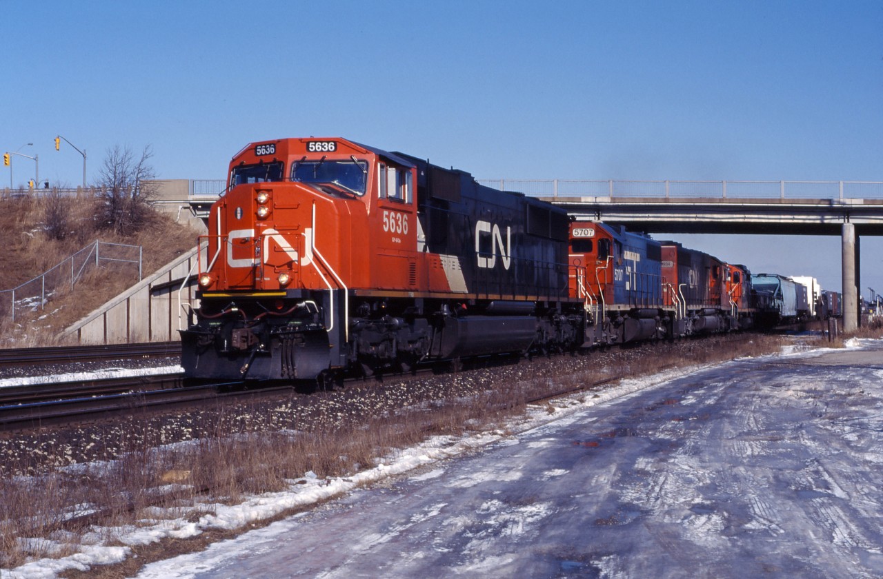 Aldershot used to be a wonderful place to watch trains. You could drive down to the tracks, park near the old "cold storage" and take photos to your heart's content or just watch the action, undisturbed. On a bright January afternoon in 1997, a CN westbound rolls through behind new SD75I 5636, GTW GP38-2 5707 (soon to be renumbered 4907, formerly MP 2027), GTW SD40-2 5934 (formerly UP 4180), a 7200 series GP9RM and a slug (the latter two units likely bound for Sarnia).