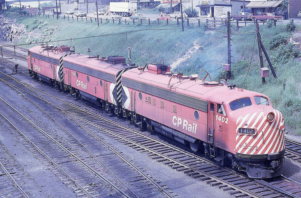 The inbound power from CP Train 2, The Canadian, has cut away from its train at the Sudbury, Ontario station.  The middle unit, 1908, will be set off while the two A units, 1402 and 1404, will be coupled back up and take number 2 to Montreal.  The 1908 will return west on that night's #1.  A yard crew will eventually take the 1908 to the shop area.
