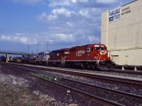 A CP westbound rolls past the Cold Storage building at Aldershot on a beautiful spring 1995 evening. Power is former SOO Line SD40-2 762 in CP Rail System paint, HATX GP40-2 508 (originally built as Boston & Maine 315 in 1977; later acquired by CP and numbered 4654), and PNC SD 3107.