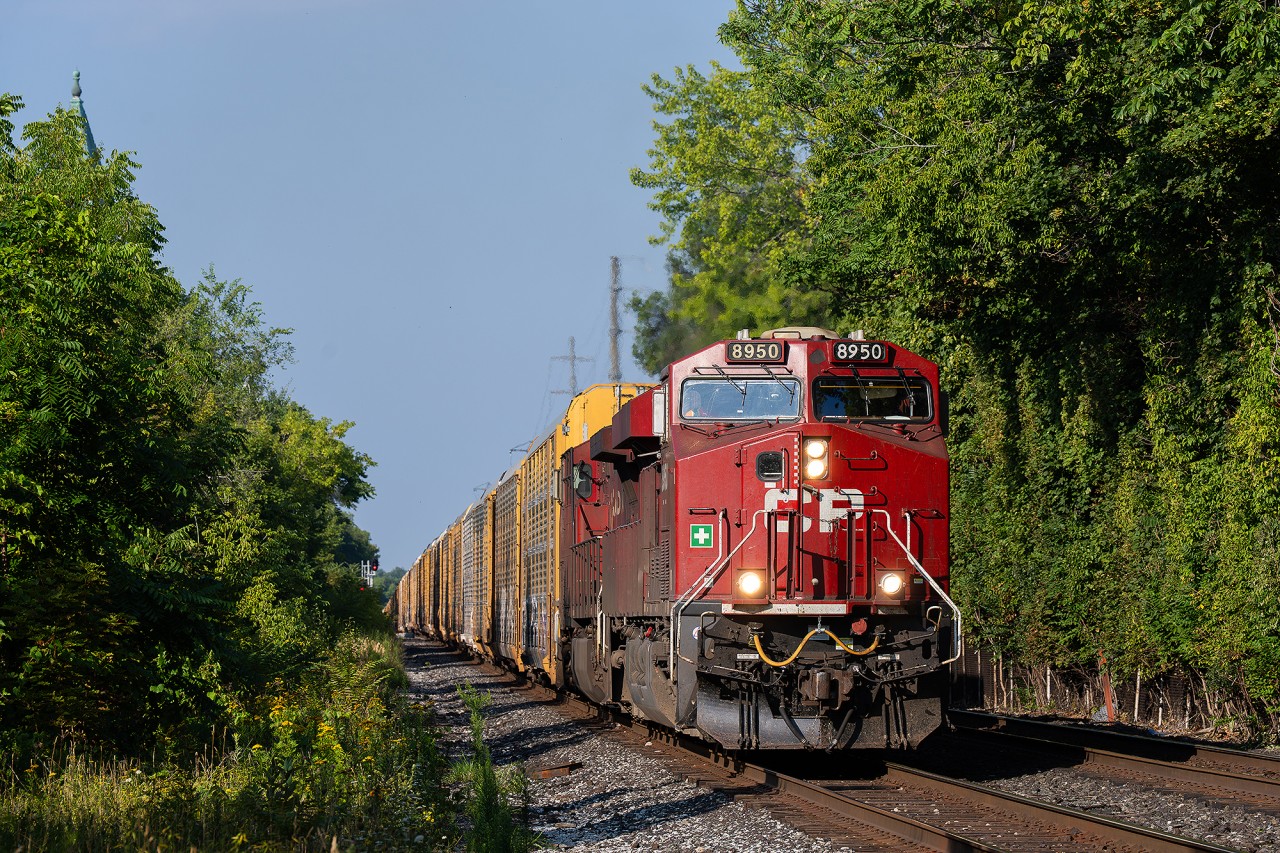 CP eastbound auto train, possibly no.734 I do not recall, heading eastbound through town at mile 2 of the North Toronto Subdivision.