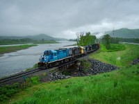 Former tourist train L'Amiral RS-18u #1849 leads the Monday Matapédia - New Richmond run on a foggy morning through the old town of Sillarsville, now part of Ristigouche-Sud-Est. It is very common to be greeted by fog when driving through the Ristigouche river valley at this time of the day.