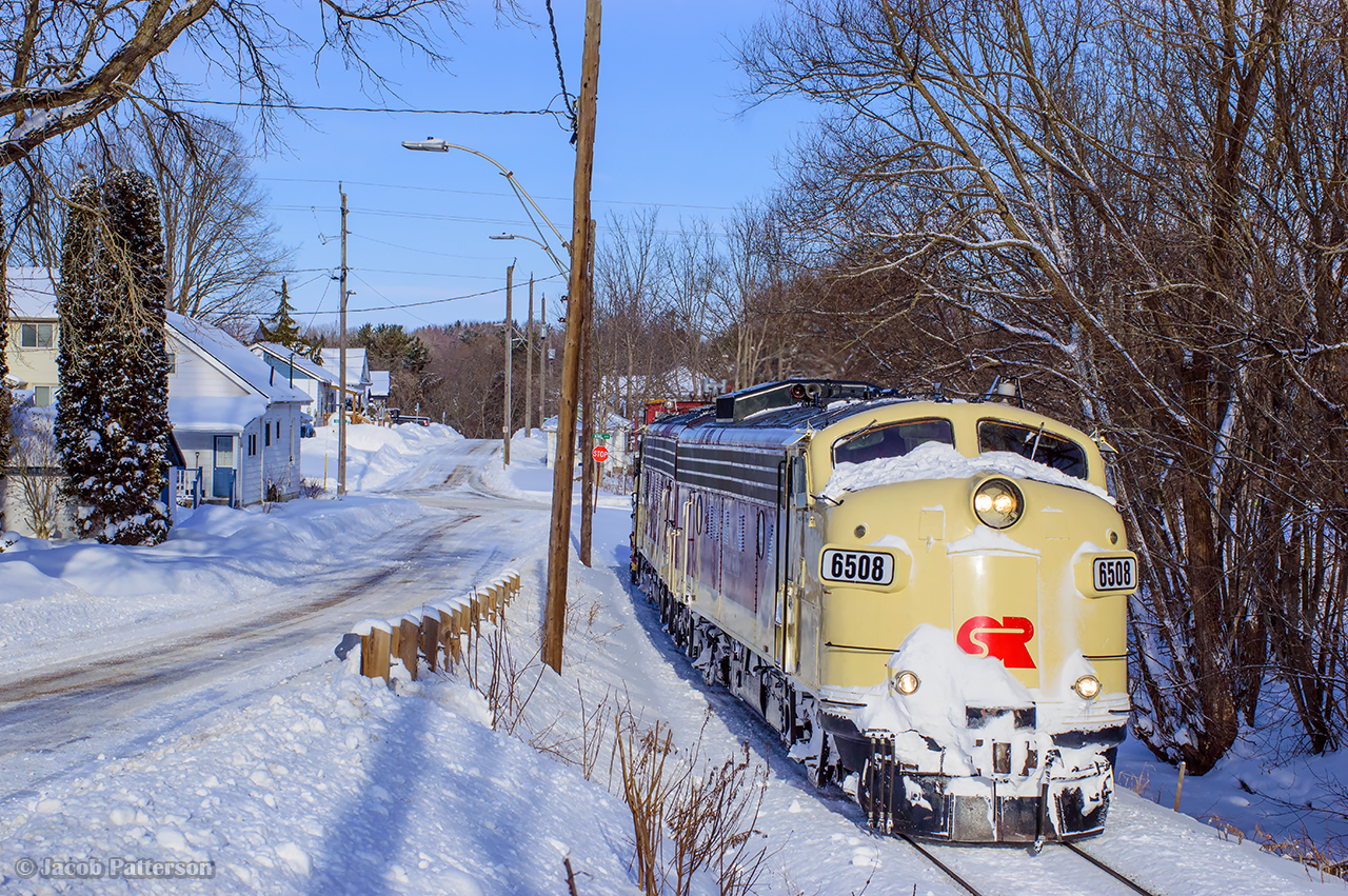Negotiating the curves through Ingersoll, Plow Foreman Jack Hyde, and his assistant, Travis, keep a sharp eye on road traffic, calling out crossing protection at King Street to Engineer Larry Broadbent on approach to the junction with the St. Thomas Sub.  Shortly, Conductor Steve Lucas will line them up to wye at CAMI and begin plowing west.  Next stop, coffee at Belmont.