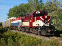Ontario Southland Railway 182 and 644 approach Domtar Line west of Beachville with a long string of racks for Cami in tow. Late January, 2026, OSRX 182 departed Salford for the last time enroute to it's new owner, the Chemin de fer Sartigan. Back in 2020 OSRX 644 and the other three M-420(W) were sold to the CFS also, so soon it may be possible to photograph these same two locomotives together again on the Sartigan in Quebec.