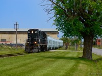 Moving slowly out of Steelcon's Grantham Avenue facility, 1859 has eight new NSC coil cars on the drawbar, each having their lids constructed and installed here.  In recent months, most of the trackage north of the Grimsby Sub has been lifted.