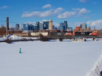 Clean CN 8333 leads a late CN 322 over the Lachine Canal, with CN 2941 trailing.