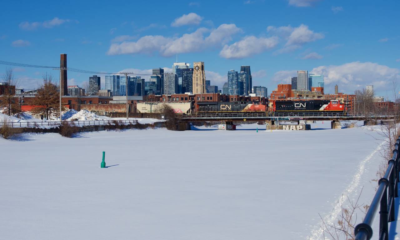 Clean CN 8333 leads a late CN 322 over the Lachine Canal, with CN 2941 trailing.