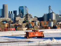 GTW 79047 is stopped at CN's Pointe St-Charles Yard. Soon it will be be tacked on the back of some grain cars and head to a nearby client. It will be used as a shoving platform on the way back.