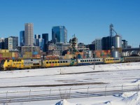 VIA 633 for Ottawa passes the skyline of Montreal with a mixed LRC/HEP consist.