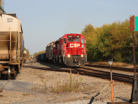 On a hot day at the beginning of fall, CP G62 pulled into Winchester Grain Mill, picked up several railcars, and left. This photo was taken when it was leaving, it pulled out of the crossing slowly heading eastbound to Smiths Falls