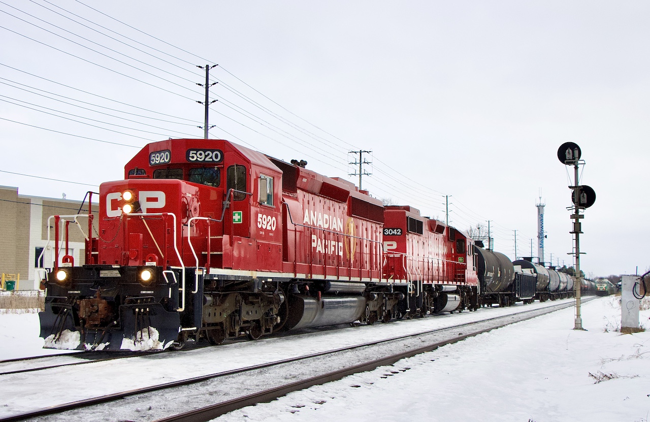 Yesterday’s oddball H24 brought back memories of the old CP Guelph Junction turn  that up till the end of the 1990’s ran between Agincourt and the junction typically with a pair of SD40’s, often working Streetsville yard on the eastbound trip. While the branch at Streetsville is restricted to four axle power the yard lead must have been exempt. Later years found a pair of GP9’s running that turn job until it was abolished. Back then Streetsville and its industries were typically served by a local out of Guelph junction until it was relocated to West Toronto by the 2000’s. Today the power typically is just a pair of GP38’s or GP20’s. When Hornby yard was converted to a trans load facility it added much needed traffic to the local and from time to time requires larger power depending on train size. Yesterday was only the second time I have seen six axle power added for a run to Hornby. The first time it was a solo SD60, this time SD40 5920. Tho lash up guaranteed there would be no work in Streetsville and a straight shot to Hornby. After catching the westbound run I figured I’d be out of luck catching the SD40 leading the eastbound run, but it took a few hours to finally make its way back home. Unfortunately the lighting conditions deteriorated and almost got blocked by a GO train but still managed to catch the train at Meadowvale.