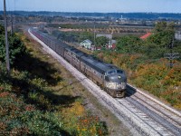 After shooting it <a href=https://www.railpictures.ca/?attachment_id=58403>at Bayview as CPR 321,</a> the Toronto - New York train has changed power and numbers at TH&B Hunter Street, seen climbing the Niagara Escarpment at Highway 20 in Stoney Creek as TH&B 372.

<br><br><i>Scan and editing by Jacob Patterson.</i>