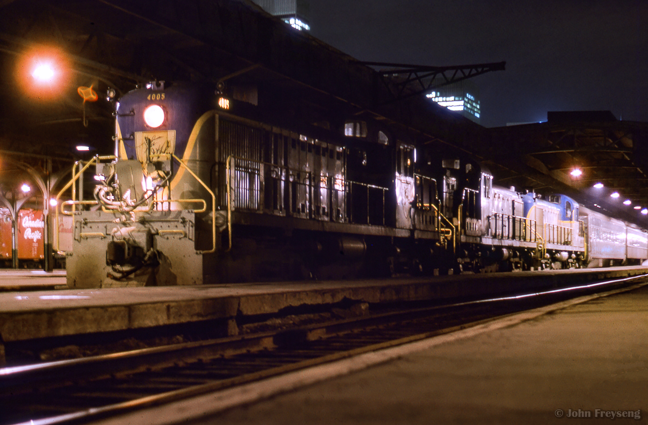 Daily except Saturday Delaware & Hudson train 10, from Montreal's Windsor Station to New York's Grand Central Terminal, sits at the platform behind a trio of ALCO RS3s awaiting its 22:20 departure time.

In about a year's time, the D&H will attempt to revitalize their Montreal operation with the use of four ALCO PA-4s.  More to come...

Scan and editing by Jacob Patterson.