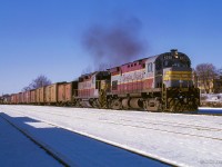 An eastbound freight for Montreal passes through Belleville behind a C-424 (still with its high-mounted headlight,) and a GP35.

<br><br><i>Scan and editing by Jacob Patterson.</i>