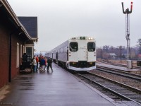 The first GO test train to be operated over the Oakville Sub is seen eastbound at CN's Port Credit station with cab car C751 in the lead.  GMD GP40TC 602 shoves on the west end of the train.

<br><br>With GO service preparing to begin on May 23, 1967, testing was getting underway starting with two runs on this day from Spadina - Oakville - Pickering and return.  The same trip would operate again on April 10 for project officials.  Beginning April 11, and accompanied by CN dynamometer car 69, GO equipment would head for Fort Erie to begin testing along the Cayuga Sub between Welland Jct. and Canfield Jct. to evaluate acceleration and braking.  Mimico - Niagara Falls testing would take place during early May, with final test runs taking place Oakville - Pickering in the final days leading up to the start of service.

<br><br>Prior to all this, GO 600 had been sent north to Fort William, where coaches were under construction by Hawker-Siddeley.  This equipment was operated in testing over CN's Kinghorn Sub from Fort William to Longlac.  Further information found in UCRS newsletters from March, April, and June, 1967.

<br><br><i>Scan and editing by Jacob Patterson.</i>