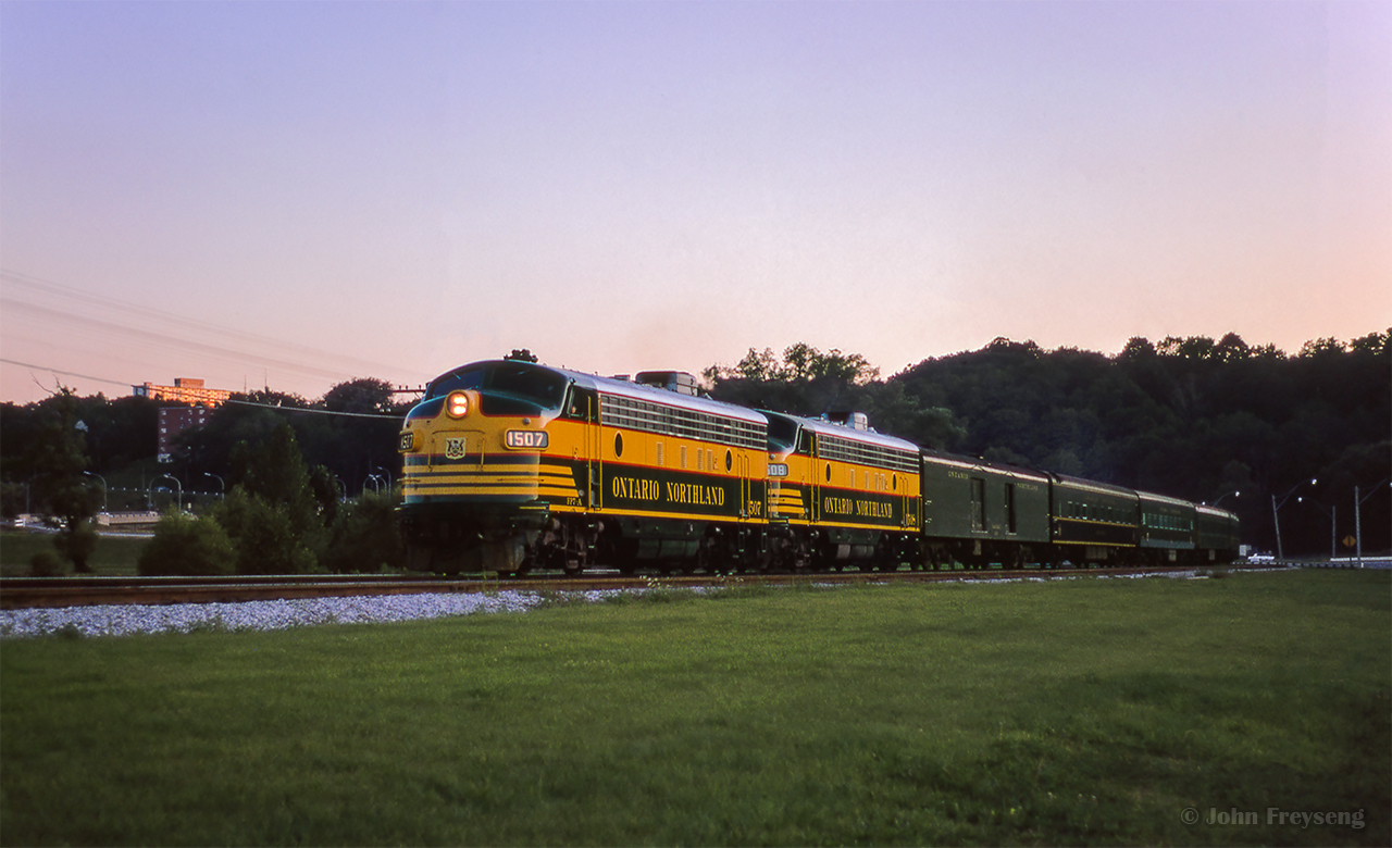 Northbound through Rosedale at last light, CNR/ONR's joint Northland rumbles through the Don Valley to start its overnight, 15 hour run to Hearst.

Scan and editing by Jacob Patterson.