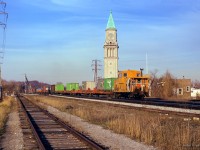 A spring evening finds an eastbound along the North Toronto Sub, passing the old north Toronto station at Yonge Street with Angus van 438889 carrying the markers.

<br><br><a href=https://www.railpictures.ca/?attachment_id=57819>Three C424s on the head end</a>

<br><br><a href=https://www.railpictures.ca/?attachment_id=57691>Approaching the scene.</a>

<br><br><i>Scan and editing by Jacob Patterson.</i>
