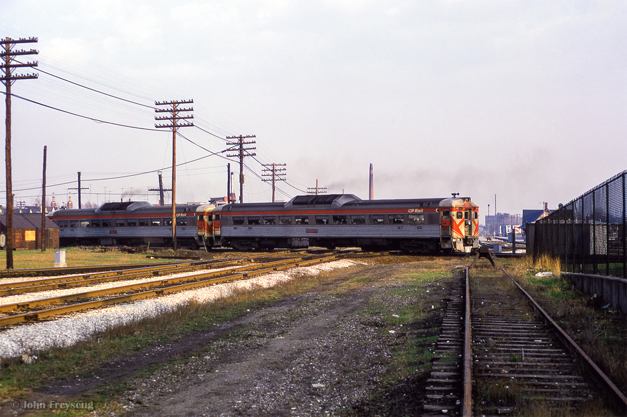 With CN 987  in the clear, rerouted CP 380 for Peterborough can finally proceed east along the North Toronto Sub, rejoining its regular route at Leaside.  For about ten days in April 1973, these Budds would access Union Station via West Toronto on account of mudslides on the Belleville Sub Don branch near the Prince Edward Viaduct. Usually running west of the junction and taking the Galt Sub downtown, on one occasion, there was an issue with the interlocking, and the Budds were required to use the Galt - Mactier connecting track, swinging east onto the North Toronto Sub at Osler.

Budds approaching West Toronto
Budds swinging west on the Galt

Scan and editing by Jacob Patterson.
