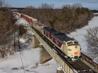 The sight of F Units at Coakley is nothing new, but certainly not a daily occurrence.  The CP business train has not run through here since October of 2018, leaving OSR's famed units as the only example since of F Units over the Thames River at this spot. <br> <br> OSR 6508 and 1401 (ex-CN 6508 and 6523) are carrying out their work authority on the Galt Subdivision in Woodstock as they interchange cars at Coakley siding.  It was lucky to have the sun come out during this very cloudy day for this brief moment.