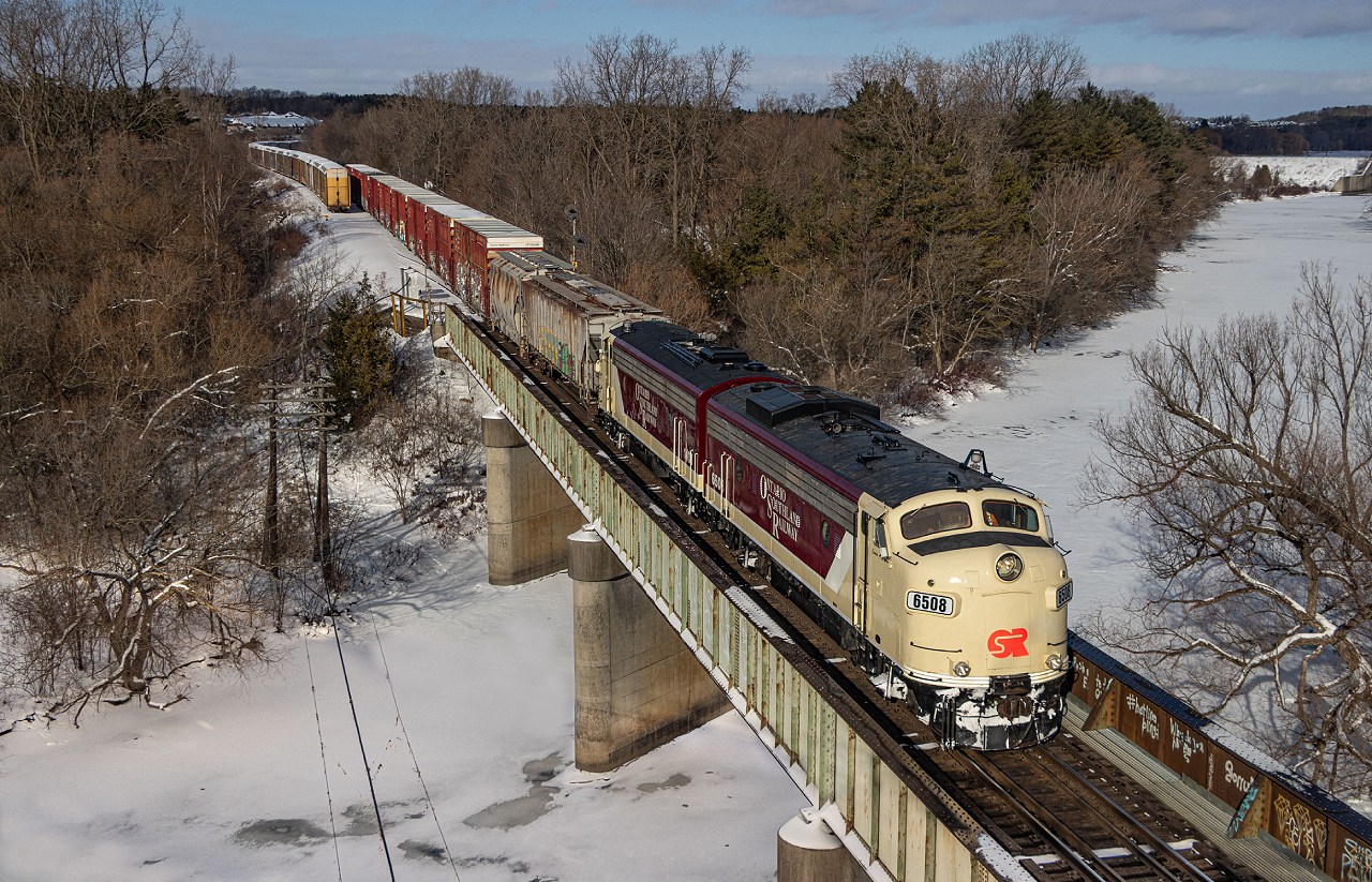 The sight of F Units at Coakley is nothing new, but certainly not a daily occurrence.  The CP business train has not run through here since October of 2018, leaving OSR's famed units as the only example since of F Units over the Thames River at this spot.   OSR 6508 and 1401 (ex-CN 6508 and 6523) are carrying out their work authority on the Galt Subdivision in Woodstock as they interchange cars at Coakley siding.  It was lucky to have the sun come out during this very cloudy day for this brief moment.