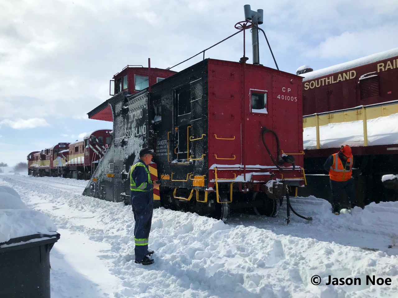 During a day filled with snow squalls and heavy winds, Ontario Southland Railways crews were hard at work plowing both their lines to Tillsonburg and St. Thomas. Here, the plow is seen uncoupled beside the Salford shop as the pair of FP9u’s had went ahead to battle some deep drifts solo just outside Salford. A short time later, the FP9u’s would return and couple to plow 401005 resuming snow clearing efforts for the remainder of the afternoon on the St. Thomas Subdivision.