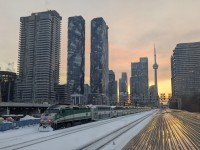 A GO Transit commuter train pauses at Toronto’s Union Station as the winter sun sinks toward the horizon around 5:15 p.m. Seen from the elevated vantage point of VIA Rail’s Laurentides Park car (8709), the fading January light casts a calm, end-of-day glow over the busiest passenger rail hub in Canada.