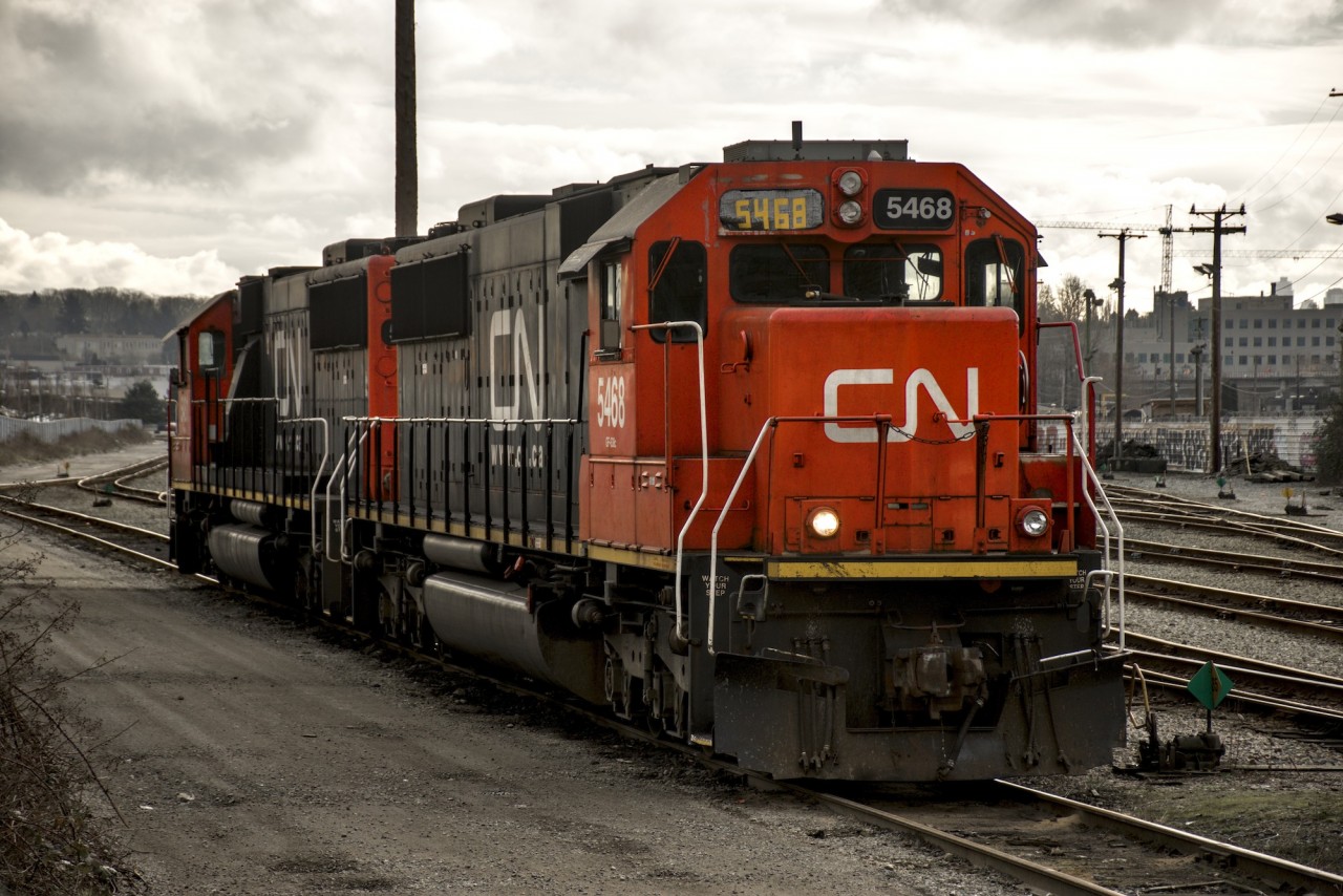 A good looking pair of CN SD60s sit in the CN New Westminster yard awaiting their next assignment. Note the improvised numbering board made out of what looks like duct tape!