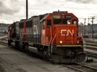A good looking pair of CN SD60s sit in the CN New Westminster yard awaiting their next assignment. Note the improvised numbering board made out of what looks like duct tape!