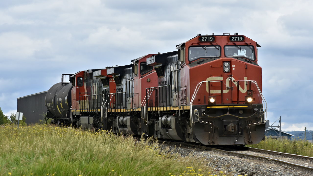 Three old Dash 9s (the middle one being a rare C44-9WL) lead a single LPG car out of the loading facility towards the grain elevators behind the camera. Ironically, the locomotives outnumber the cars 3-1, equaling a total of 22 axels...